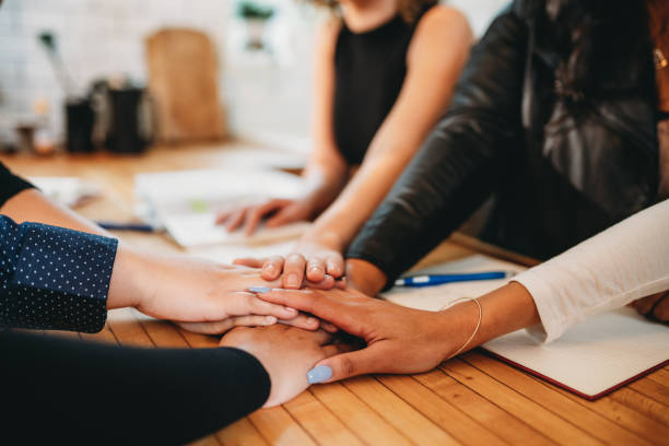 istock Students are stacking hands together while they are studying for the next exam 1500511042