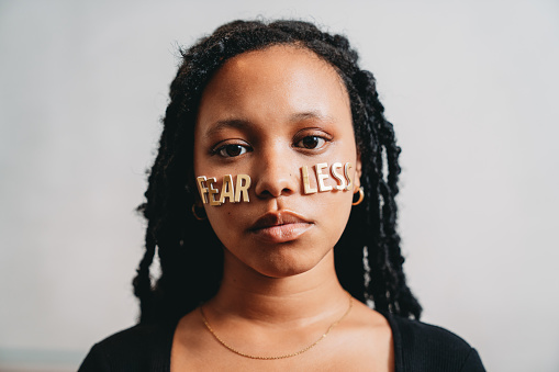 Portrait of a young adult woman with the word 