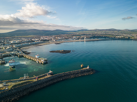 Douglas, Isle of Man - 25 March 2023: view of Douglas Bay with the entrance to Douglas South Quay Harbour, Isle of Man Sea Terminal, and Central Promenade