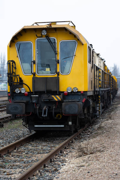 istock A yellow technical train for grinding rails standing on a railway siding. 1500512947