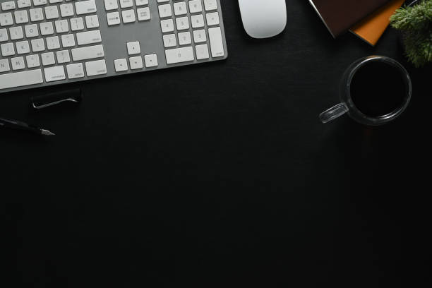 istock Top view, flat lay with copy space. Blan working desk with a cup of coffee, keyboard, mouse and notebook. 1500513288