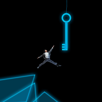 Motivated young employee jumping to catch a key symbolizing new knowledges, professional skills and promotion. Contemporary art collage. Concept of business, office, career development. Dark mode