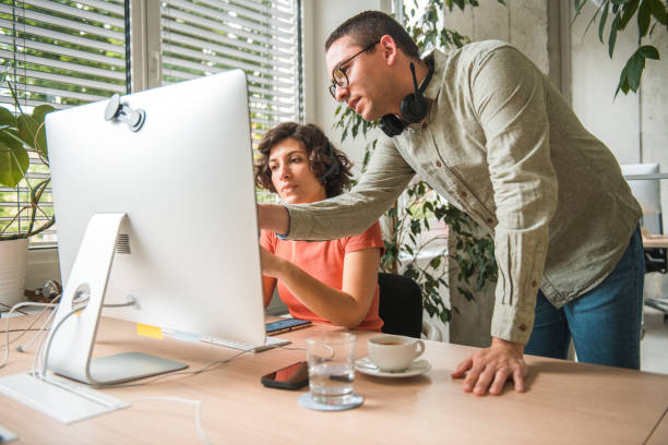 istock Caucasian Female Employee and Hispanic Call Center Manager Resolving Client Issues 1500517596