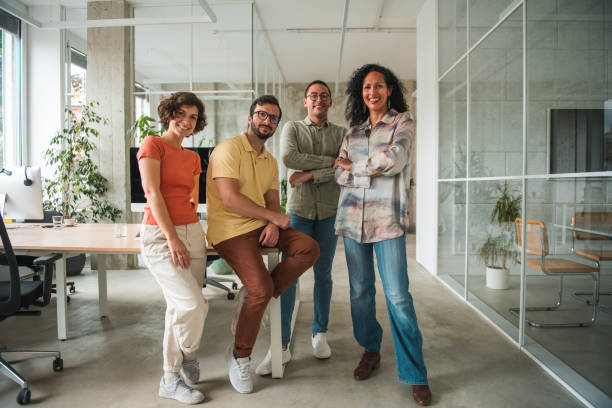 istock Diverse Call Center Team Strikes a Pose with Hands Crossed in a Modern Office 1500517636