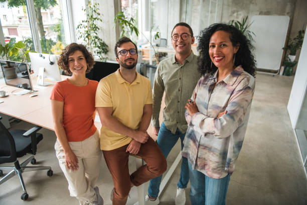 istock Multicultural Call Center Team Strikes a Strong Pose with Crossed Hands in a Contemporary Office 1500517641