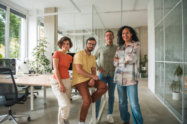 istock Dynamic Call Center Team Strikes a Confident Pose with Crossed Hands in a Modern Office 1500517718