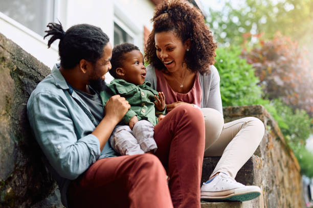 istock Happy black kid having fun with his parents outdoors. 1500524086
