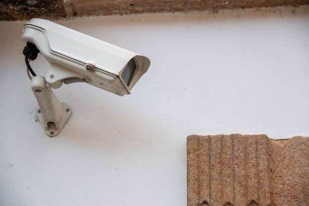istock Security camera installed on a support on the wall of a street 1500526143