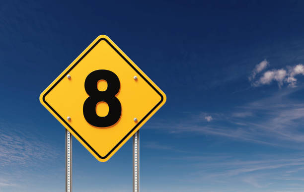 Number 8 written yellow off road traffic sign before blue sky. Horizontal composition with copy space.