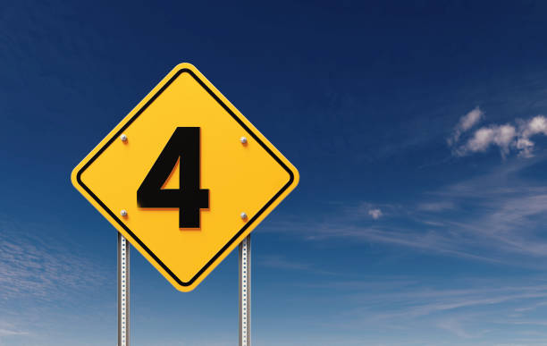 Number 4 written yellow off road traffic sign before blue sky. Horizontal composition with copy space.