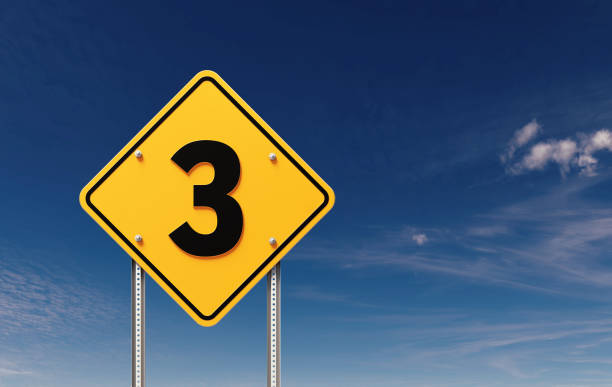 Number 3 written yellow off road traffic sign before blue sky. Horizontal composition with copy space.