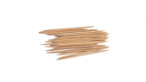 pile of wooden cleaning toothpicks, on a white or isolated background