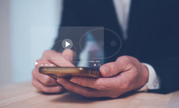 istock Man using online entertainment mobile applications surfing social media searching internet.Social media and digital online concept, man using smart phone. The concept of living on vacation 1500535321