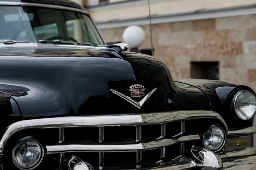 Minsk, Belarus, June 2023 - Classic Cadillac car parked at town. vintage american automobile