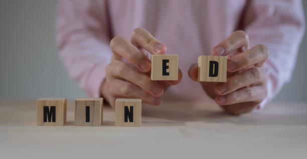 istock Mine and Mind text on wooden block. thinking concept idea. man hand choosing block 1500535521