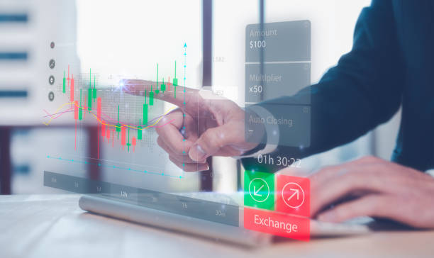 istock financial investment concept, businessman using computer keyboard with virtual trading graph stock or cryptocurrency exchange in concept of investment business growth and marketing 1500535597