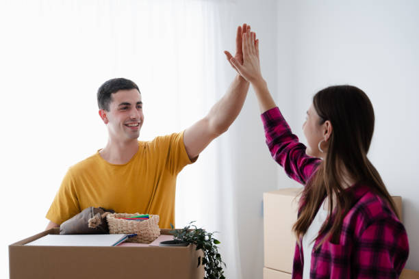 istock Young man giving high five to girlfriend 1500535933