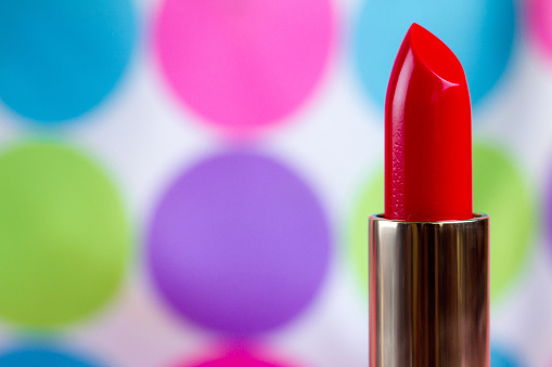 Red lipstick close-up. Women's cosmetics for professional makeup. Copy space