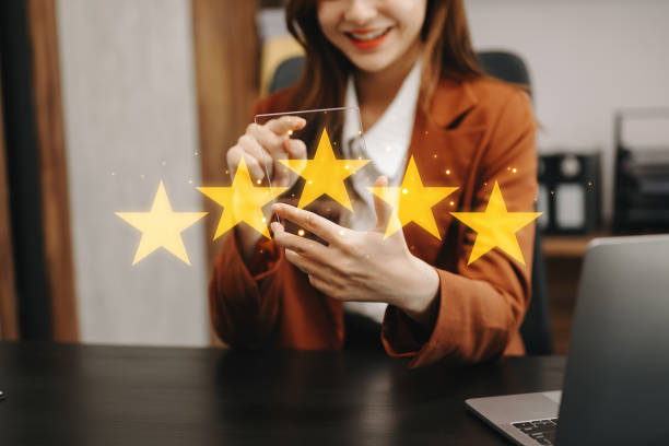 istock Customer or client the stars to complete five stars. with copy space. giving a five star rating. Service rating, satisfaction concept. 1500542113