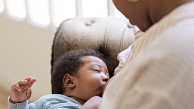 Close-up of Black baby boy breastfeeding