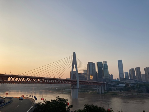 ChongQing, China – October 05, 2021: Big Bridge on the Changjiang River at dusk in Chongqing in china
