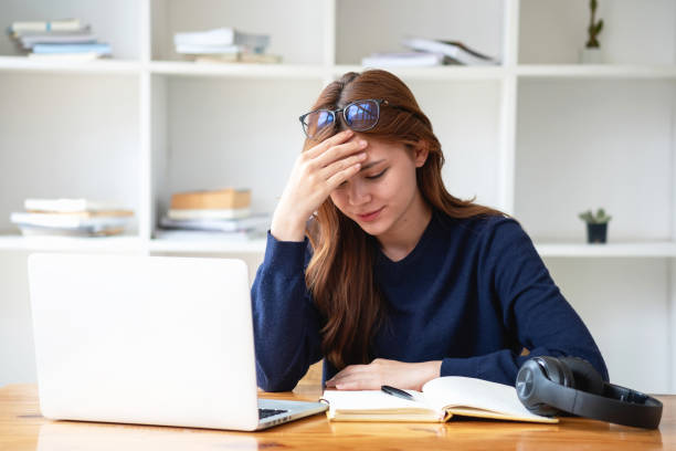 istock Concept Burnout Syndrome.  A woman feels uncomfortable working. Which is caused by stress, accumulated from unsuccessful work And less resting body. Consult a specialist psychiatrist. 1500550911