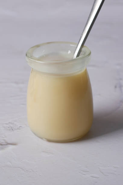 istock condensed milk in a bowl close up, 1500551806