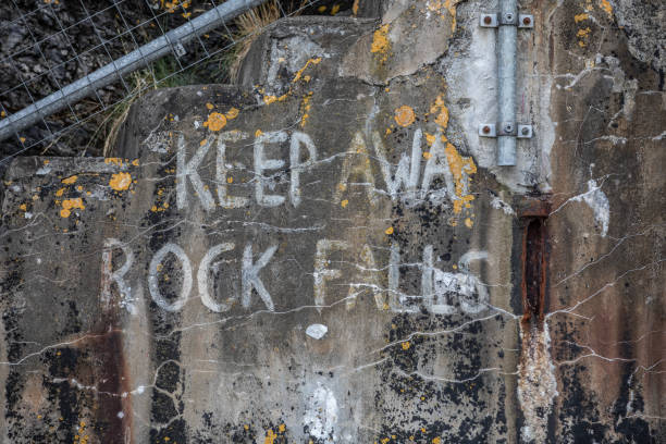 istock Harbour wall with a painted warning - 
