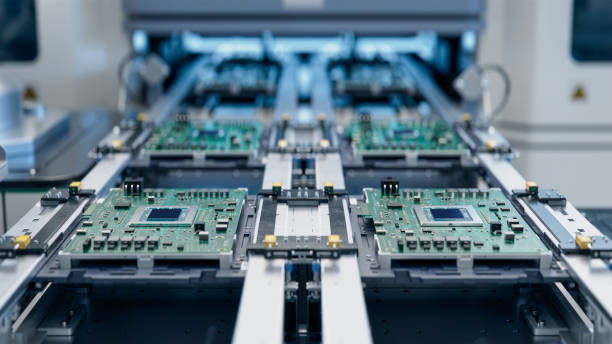 istock Advanced Circuit Boards on Assembly Line. Electronic Devices Production Industry. Fully Automated PCB Assembly Line. Electronics Manufacturing Facility or Factory. 1500558446