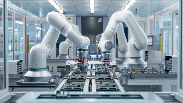 istock Fully Automated Modern PCB Assembly Line Equipped with Advanced High Precision Robot Arms at Bright Electronics Factory. Electronic Devices Production Industry. Component Installation on Circuit Board 1500558474