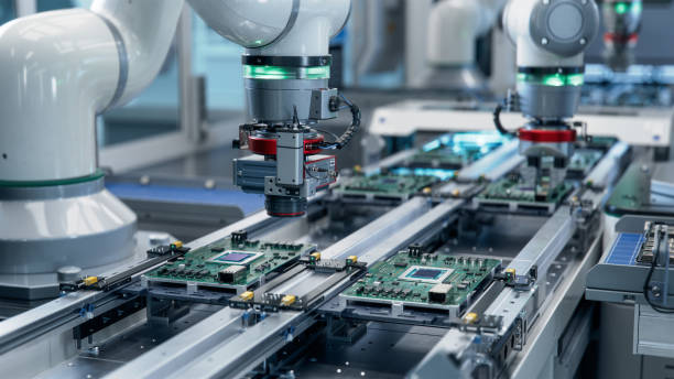 istock Component Installation and Quality Control of Circuit Board. Fully Automated PCB Assembly Line Equipped with High Precision Robot Arms at Electronics Factory. Electronic Devices Manufacturing Industry 1500558484