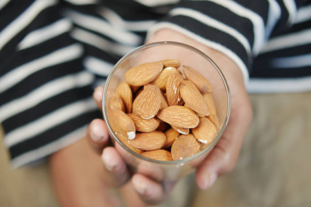 istock close up of almond nuts on man's hand 1500558627