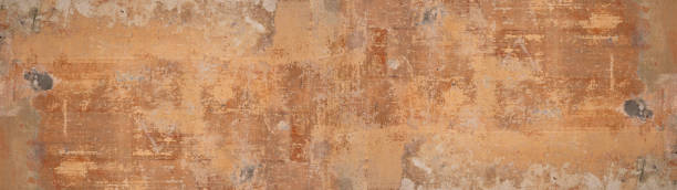 istock Old brown gray rusty vintage worn shabby patchwork motif tiles stone concrete cement wall texture background banner panorama 1500560281