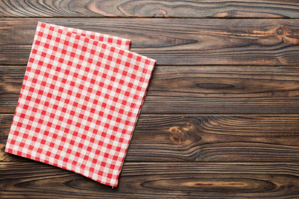 istock top view with red empty kitchen napkin isolated on table background. Folded cloth for mockup with copy space, Flat lay. Minimal style 1500560548