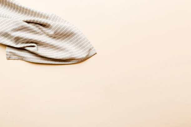 istock top view with gray kitchen napkin isolated on table background. Folded cloth for mockup with copy space, Flat lay. Minimal style 1500560550