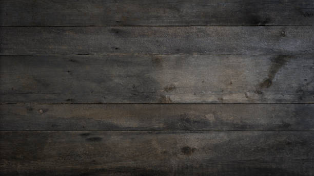 istock Old brown rustic dark grunge wooden timber wall or floor or table texture - wood background banner 1500560691