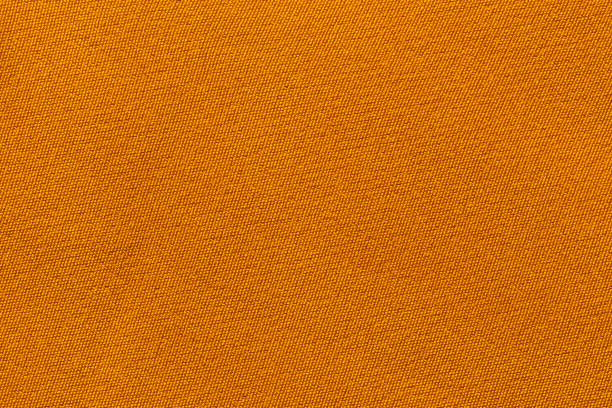 istock Orange color fabric cloth polyester texture and textile background. 1500565851
