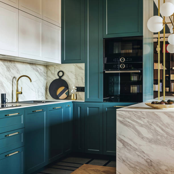 istock Luxury modern and vintage turquoise and white kitchen. Marble kitchen island with white owal chandelier . Gold tap on marble table top. Template. 1500566135
