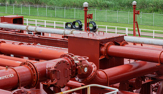 Part of the deck of an oil tanker with pipeline. View of the inert gas valve
