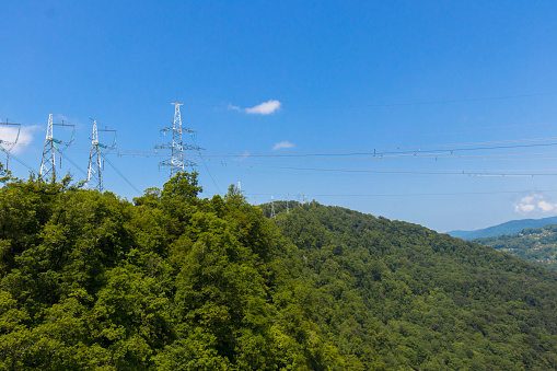 High-voltage line through a mountain gorge