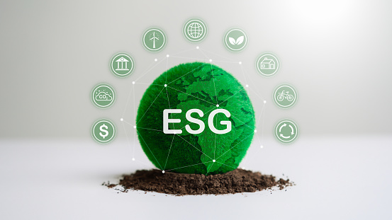 ESG World Earth green sphere grass ball and World Environment Day soil white background. Business development and eco friendly concept. World saving and global warming theme. Sustainable energy CSR.