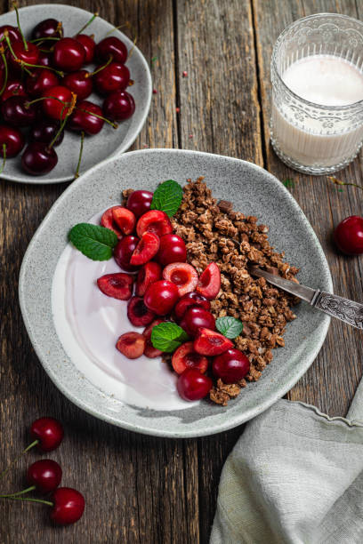 Granola with yogurt and cherries in a bowl