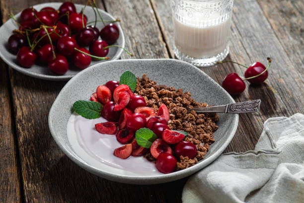 Granola with yogurt and cherries in a bowl