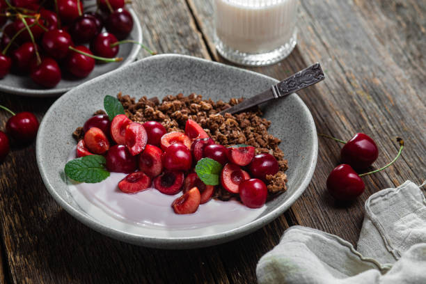 Granola with yogurt and cherries in a bowl