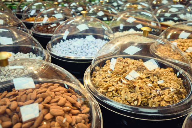 Almond kernels, hazelnut kernels and other dried fruits and nuts on a store counter
