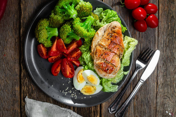 Baked chicken fillet with vegetables in a plate