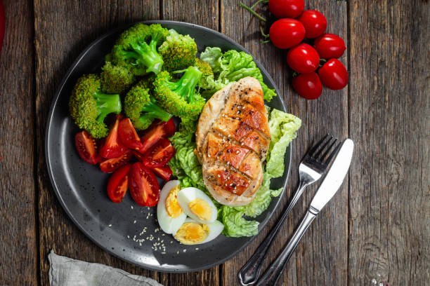 Baked chicken fillet with vegetables in a plate