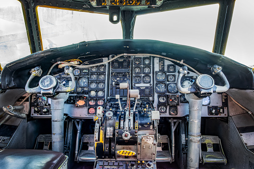 Vintage dashboard, commands and controls in the cockpit of an E-2 Hawkeye aircraft
