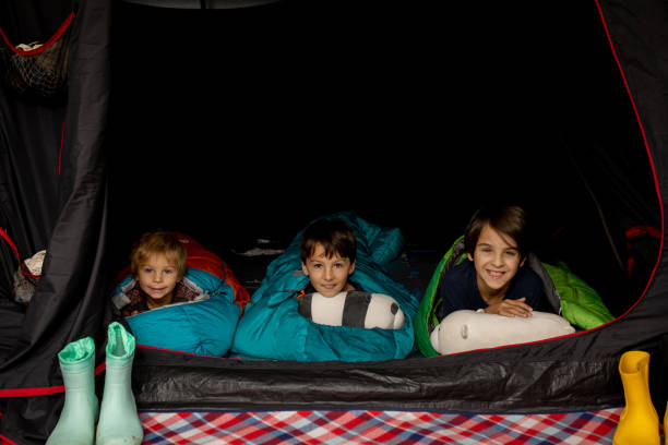 istock Children, siblings, sleeping in sleeping bags in a tent in Norway 1500575606
