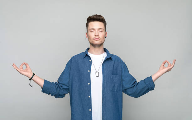 istock Portrait of young man maditating with eyes clsoed 1500575852